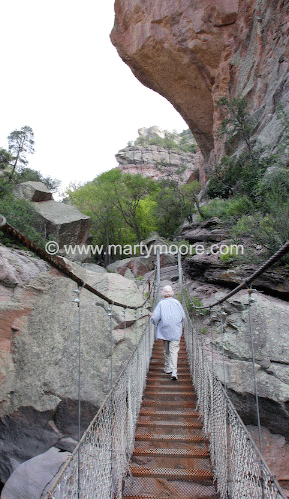 Woman walking across a bridge at the Cat Walk 